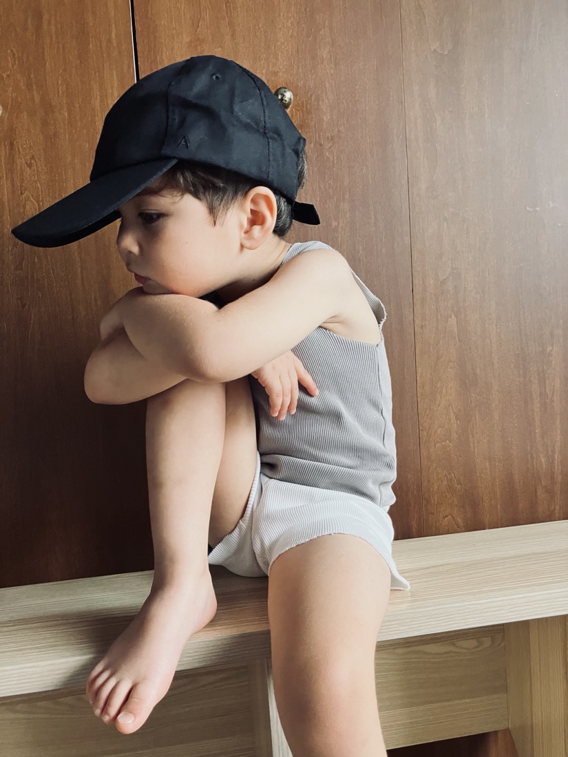 Child in a cap wearing A Basic Brand ribbed set